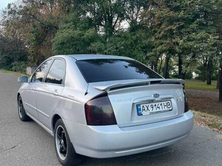 Серый Киа Черато, объемом двигателя 2 л и пробегом 350 тыс. км за 4100 $, фото 1 на Automoto.ua