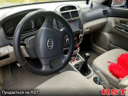 Серый Киа Черато, объемом двигателя 2 л и пробегом 270 тыс. км за 3600 $, фото 1 на Automoto.ua