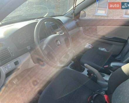 Синий Киа Черато, объемом двигателя 1.6 л и пробегом 350 тыс. км за 3000 $, фото 16 на Automoto.ua