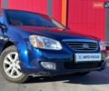 Синій Кіа Черато, об'ємом двигуна 2 л та пробігом 110 тис. км за 6390 $, фото 1 на Automoto.ua