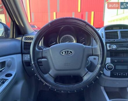 Синій Кіа Черато, об'ємом двигуна 2 л та пробігом 110 тис. км за 6390 $, фото 13 на Automoto.ua
