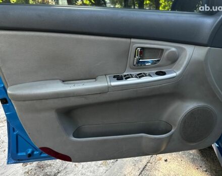 Синий Киа Черато, объемом двигателя 1.6 л и пробегом 248 тыс. км за 5990 $, фото 8 на Automoto.ua