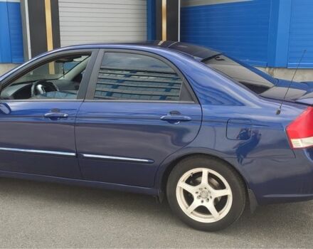 Синий Киа Черато, объемом двигателя 2 л и пробегом 420 тыс. км за 3900 $, фото 1 на Automoto.ua