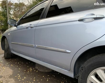 Синій Кіа Черато, об'ємом двигуна 2 л та пробігом 199 тис. км за 5299 $, фото 3 на Automoto.ua