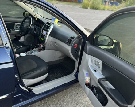 Синий Киа Черато, объемом двигателя 2 л и пробегом 258 тыс. км за 5500 $, фото 8 на Automoto.ua