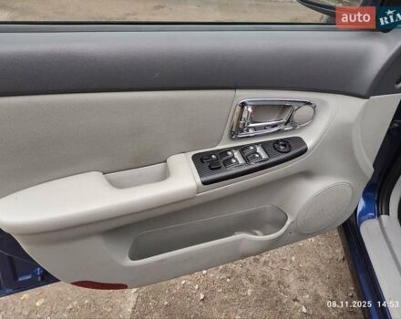 Синий Киа Черато, объемом двигателя 1.98 л и пробегом 246 тыс. км за 4400 $, фото 32 на Automoto.ua