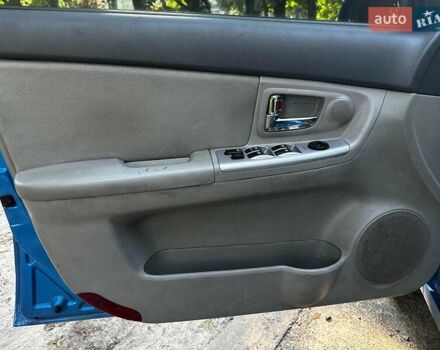 Синій Кіа Черато, об'ємом двигуна 1.6 л та пробігом 248 тис. км за 5990 $, фото 8 на Automoto.ua