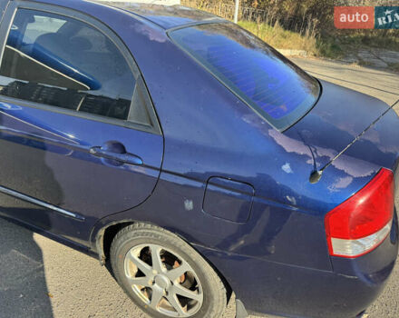 Синий Киа Черато, объемом двигателя 1.59 л и пробегом 250 тыс. км за 3100 $, фото 11 на Automoto.ua