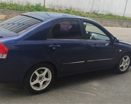 Синий Киа Черато, объемом двигателя 2 л и пробегом 420 тыс. км за 3900 $, фото 2 на Automoto.ua
