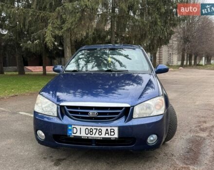 Синий Киа Черато, объемом двигателя 2 л и пробегом 200 тыс. км за 4000 $, фото 1 на Automoto.ua