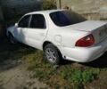 Белый Киа Кларус, объемом двигателя 2 л и пробегом 470 тыс. км за 404 $, фото 2 на Automoto.ua