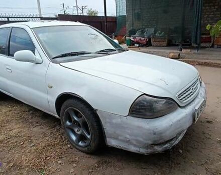 Белый Киа Кларус, объемом двигателя 1.8 л и пробегом 240 тыс. км за 427 $, фото 2 на Automoto.ua