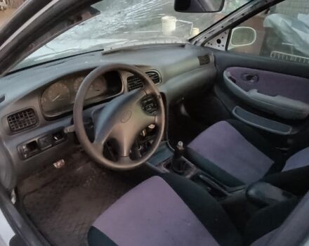 Белый Киа Кларус, объемом двигателя 2 л и пробегом 260 тыс. км за 453 $, фото 2 на Automoto.ua