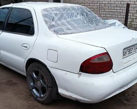 Белый Киа Кларус, объемом двигателя 1.8 л и пробегом 240 тыс. км за 427 $, фото 3 на Automoto.ua