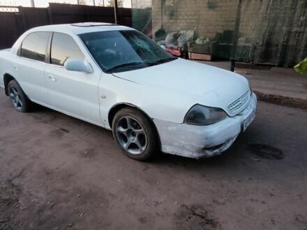 Белый Киа Кларус, объемом двигателя 2 л и пробегом 260 тыс. км за 453 $, фото 1 на Automoto.ua