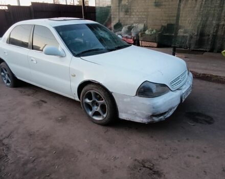 Белый Киа Кларус, объемом двигателя 2 л и пробегом 260 тыс. км за 453 $, фото 1 на Automoto.ua