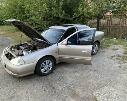 Бежевий Кіа Кларус, об'ємом двигуна 2 л та пробігом 327 тис. км за 2000 $, фото 5 на Automoto.ua