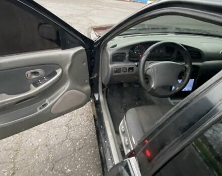 Чорний Кіа Кларус, об'ємом двигуна 2 л та пробігом 300 тис. км за 1600 $, фото 7 на Automoto.ua