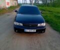 Черный Киа Кларус, объемом двигателя 2 л и пробегом 280 тыс. км за 1600 $, фото 1 на Automoto.ua