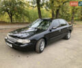 Чорний Кіа Кларус, об'ємом двигуна 2 л та пробігом 493 тис. км за 1850 $, фото 1 на Automoto.ua