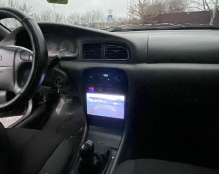 Чорний Кіа Кларус, об'ємом двигуна 2 л та пробігом 300 тис. км за 1600 $, фото 12 на Automoto.ua