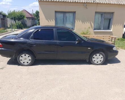 Чорний Кіа Кларус, об'ємом двигуна 2 л та пробігом 200 тис. км за 961 $, фото 1 на Automoto.ua