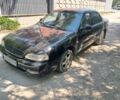 Чорний Кіа Кларус, об'ємом двигуна 2 л та пробігом 250 тис. км за 1251 $, фото 1 на Automoto.ua