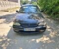 Чорний Кіа Кларус, об'ємом двигуна 2 л та пробігом 250 тис. км за 1251 $, фото 2 на Automoto.ua