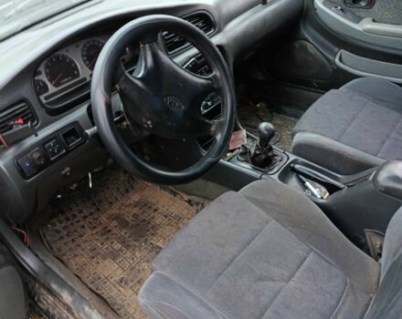 Черный Киа Кларус, объемом двигателя 1.8 л и пробегом 200 тыс. км за 650 $, фото 2 на Automoto.ua