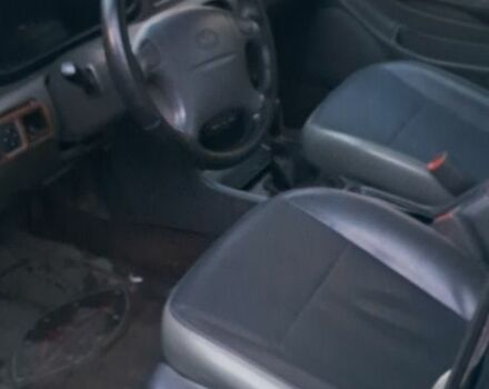 Черный Киа Кларус, объемом двигателя 2 л и пробегом 250 тыс. км за 850 $, фото 2 на Automoto.ua