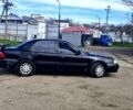 Черный Киа Кларус, объемом двигателя 20 л и пробегом 179 тыс. км за 2000 $, фото 1 на Automoto.ua