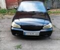 Чорний Кіа Кларус, об'ємом двигуна 2 л та пробігом 250 тис. км за 2246 $, фото 9 на Automoto.ua