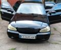 Чорний Кіа Кларус, об'ємом двигуна 2 л та пробігом 250 тис. км за 2246 $, фото 1 на Automoto.ua