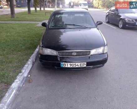 Чорний Кіа Кларус, об'ємом двигуна 2 л та пробігом 300 тис. км за 1254 $, фото 1 на Automoto.ua