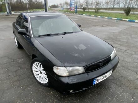 Черный Киа Кларус, объемом двигателя 2 л и пробегом 300 тыс. км за 1600 $, фото 1 на Automoto.ua