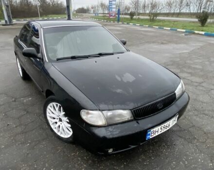 Чорний Кіа Кларус, об'ємом двигуна 2 л та пробігом 300 тис. км за 1600 $, фото 1 на Automoto.ua