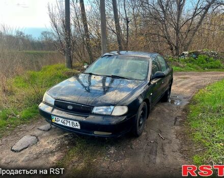 Черный Киа Кларус, объемом двигателя 2 л и пробегом 250 тыс. км за 999 $, фото 1 на Automoto.ua