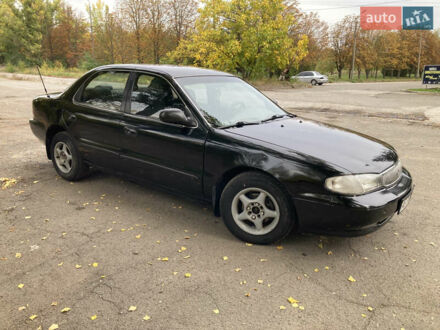 Черный Киа Кларус, объемом двигателя 2 л и пробегом 493 тыс. км за 1850 $, фото 1 на Automoto.ua