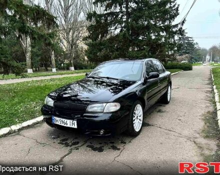 Чорний Кіа Кларус, об'ємом двигуна 2 л та пробігом 300 тис. км за 1850 $, фото 1 на Automoto.ua