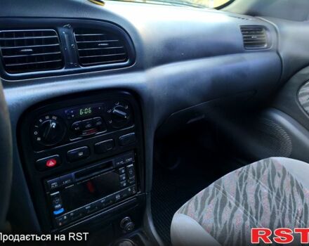 Черный Киа Кларус, объемом двигателя 2 л и пробегом 218 тыс. км за 2700 $, фото 1 на Automoto.ua