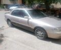Серый Киа Кларус, объемом двигателя 2 л и пробегом 350 тыс. км за 899 $, фото 1 на Automoto.ua