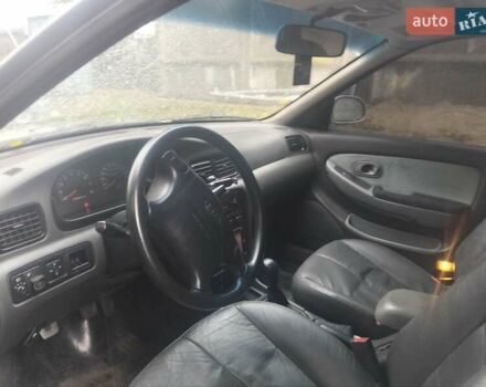 Сірий Кіа Кларус, об'ємом двигуна 2 л та пробігом 352 тис. км за 2000 $, фото 13 на Automoto.ua