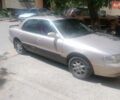 Серый Киа Кларус, объемом двигателя 2 л и пробегом 350 тыс. км за 899 $, фото 1 на Automoto.ua