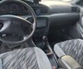 Серый Киа Кларус, объемом двигателя 2.05 л и пробегом 200 тыс. км за 1600 $, фото 1 на Automoto.ua