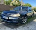 Серый Киа Кларус, объемом двигателя 1.8 л и пробегом 350 тыс. км за 450 $, фото 1 на Automoto.ua