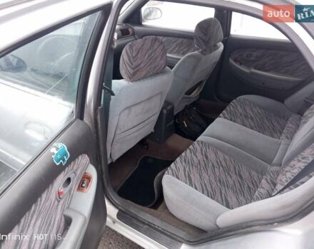 Серый Киа Кларус, объемом двигателя 1.8 л и пробегом 279 тыс. км за 1430 $, фото 4 на Automoto.ua