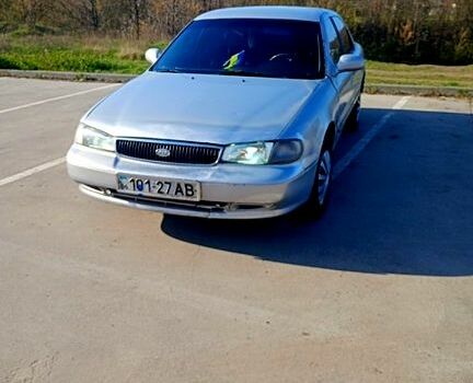 Серый Киа Кларус, объемом двигателя 2 л и пробегом 400 тыс. км за 1100 $, фото 1 на Automoto.ua