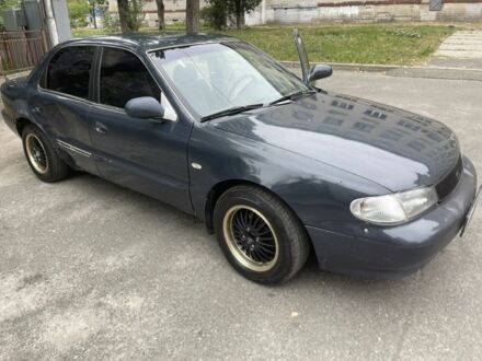 Серый Киа Кларус, объемом двигателя 2 л и пробегом 350 тыс. км за 951 $, фото 1 на Automoto.ua