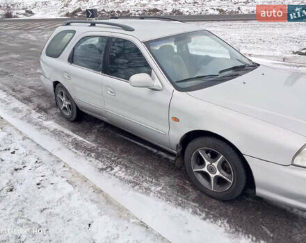 Сірий Кіа Кларус, об'ємом двигуна 1.8 л та пробігом 240 тис. км за 1750 $, фото 1 на Automoto.ua