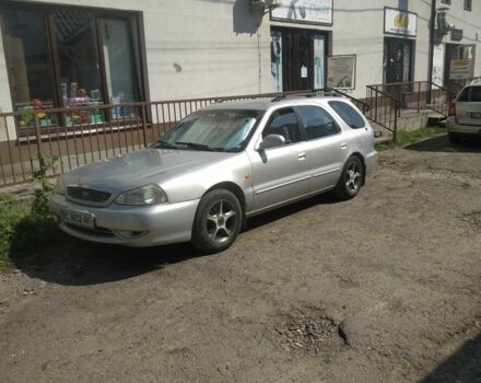 Сірий Кіа Кларус, об'ємом двигуна 1.8 л та пробігом 250 тис. км за 1298 $, фото 1 на Automoto.ua